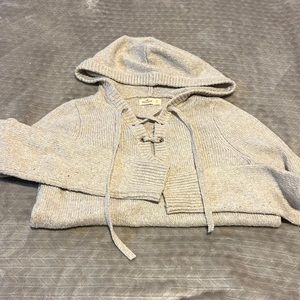 Cream colored knit lace up sweater